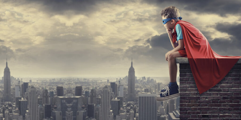 Superhero kid on rooftop StudioBinder